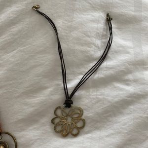 Leather and gold plated floral pendant necklace